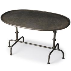 an oval metal table with two legs and a black tray on the top, against a white background