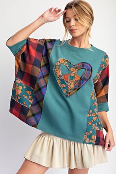 This playful top screams personality with its mix of patterns and raw, frayed heart peace patch. The short dolman sleeves and relaxed, boxy fit make it perfect for any casual outing. Plus, the raw cut and defined seams add an edgy touch. Don't miss out on making a statement with this knit top! Recycled Sweatshirts, Patchwork Tshirt, Reuse Clothes, Boho Ideas, Patchwork Sewing, Patch Top, Upcycle Clothes Diy, Boho Clothes, Recycled T Shirts