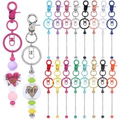 a bunch of different colored key chains hanging from hooks