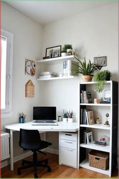 a white desk with a laptop computer on top of it next to a book shelf