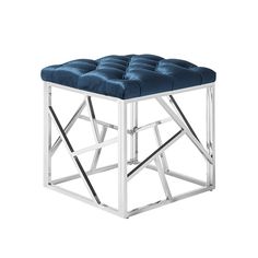 a square stool with a blue velvet seat cushion