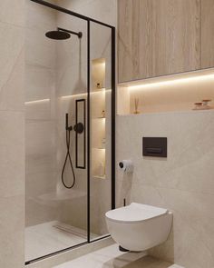 a bathroom with a toilet, shower and standup shower in the middle of it