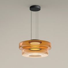 a modern light fixture hanging from the ceiling