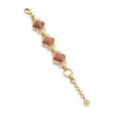 This versatile piece elevates the classic chain bracelet with an unexpected twist, artfully rendered with earthy teak beads and a subtly ornate gold motif for a dash of understated drama. Inspired by the effortless-yet-impeccable style that my fabulous French aunt achieves every day, who is able to take everything from a ballgown to a t-shirt, and make a moment of it. Pair with our Blandine Chain necklace to complete the look. Elegant Brown Jewelry With Adjustable Chain, Elegant Brown Chain Jewelry, Elegant Brown Jewelry With Chain, Chic Brown Bracelet Jewelry, Elegant Brown Jubilee Bracelet, Elegant Brown Metal Beaded Bracelets, Elegant Brown Bracelet Jewelry, Elegant Brown Beaded Bracelets, Gold Motif