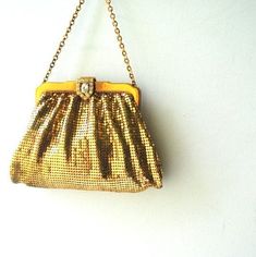 "Gatsby vintage 30s, liquid gold mesh, art deco, wedding, evening purse. Made by Whiting and Davis in USA. Closure with a lavish , clear rhinestones , exquisite clasp. One compartment with one open pocket lined with a salmon color satin. One , gold tone metal , ornate chain -small handle. Outstanding. Old Hollywood . Glamour. Runway. Look much better in person. Excellent condition. Very well preserved. Clean and strong inside and out. No any issue( true).No breaks in the mesh, no missing rhinest Gold Vintage Bag For Events, Retro Gold Evening Bag, Antique Gold Bag For Vintage Events, Victorian Gold Bag For Party, Gold Antique Bag For Vintage Events, Antique Gold Bags For Vintage Events, Antique Style Evening Clutch Bag, Victorian Rectangular Evening Bag For Party, Gold Antique Bags For Vintage Events