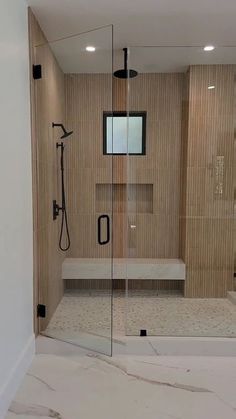 a walk in shower sitting inside of a bathroom