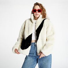 Women's Nike Sportswear Faux Fur Fossil White Jacket DM1759 Features: -Full zip Oversized Faux Fur Jacket -Nike Swoosh logo in front -Ribbed Cuff for snug fit around wrist and waist -Care instruction tag attached inside (Dry Clean Only) -Material: 100% Polyester -Style/Model: DM1759-238- Ivory DM1759-010 Black -New with original official license tags attached -MSRP: $175 -Imported, Limited Sporty Winter White Outerwear For Fall, Casual Winter White Fur Coat With Faux Fur Lining, Sporty Winter White Outerwear For Streetwear, Sporty Long Sleeve Outerwear In Winter White, Sporty Winter White Long Sleeve Outerwear, White Sporty Long Sleeve Outerwear, Sporty Long Sleeve White Outerwear, Oversized White Fur Coat For Winter, Winter White Long Sleeve Sporty Outerwear