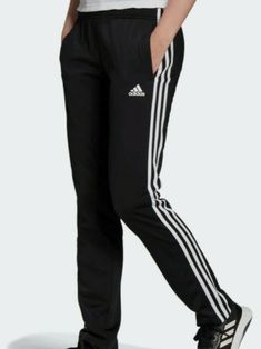 Adidas Women Ladies Essential 3 Stripes Black & White Track Pants L Large NWT The signature staple for the old-school adidas fan. These track pants rock a classic silhouette for everyday style. Throw them on before your workout for an easy warmup. A branded sign off on the left leg and iconic 3-Stripes complete the look. This product is made with Primegreen, a series of high-performance recycled materials. Climbing Stairs, Track Pants Women, Adidas Track Pants, Suit Pant, Adidas Track, Training Pants, Adidas Sportswear, Pants Large, Adidas Sport