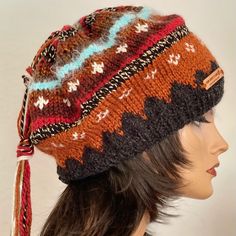 I Designed And Hand Knitted This Slouch,Beanie, Hat, Cap. Fair-Isle Style Hand Knit In Fall And Winter Rustic Shades. Top Of The Hat Has A Matching Colors Long Tassel Hanging . Warm, Cozy And Boho Chic ! Designed And Hand Knitted In California, Usa. See All Of My Original Designs Four Seasons Trendy Fine Hand Knits Listed Under “ Hand Knits 2 Love” In My Boutique: Poshmark.Com/Closet/Soheyla Brown Bohemian Beanie One Size, Black Bohemian Knitted Hat, Bohemian Brown Knitted Beanie, Bohemian Style Hats For Cold Weather, Hand Knitted Brown Bonnet One Size, Bohemian Knitted Hats For Cold Weather, Bohemian Hats For Cold Weather, Black Hand Knitted Bohemian Hats, Black Hand-knitted Bohemian Hats