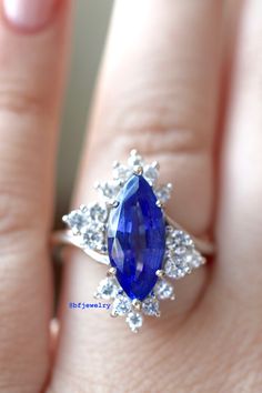 Metal: 14K White Gold Stone Types: Tanzanite And Diamonds Stone Shapes: Marquise tanzanite and round diamonds. Tanzanite Weight: Approx. 3 Carats Diamond Weight: Approx. .93 Carats Diamond Quality: Approx. SI1 G/H Weight: 6.30 Grams Size: 6 Sizable: Yes. Please state in note to seller box at checkout or message us. Original Price: $2,150.00 Appraisal & Gem Assessment: This service conducted by a GIA graduated gemologist can be provided to you free of charge. If you would like this service, p Blue Marquise Brilliant Cut Jewelry, Sapphire Multi-stone Diamond Gemstones, Exquisite Tanzanite Jewelry With Prong Setting, Timeless Tanzanite Jewelry With Accent Stones, Wedding Tanzanite Gemstones With Prong Setting, Brilliant Cut Tanzanite Gemstones, Sapphire Marquise Center Stone Jewelry, Tanzanite Gemstone Ring For Wedding, Marquise Sapphire Diamond Ring