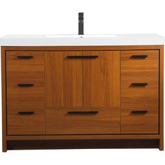 a bathroom vanity with a white counter top and wooden cabinetry on the bottom side