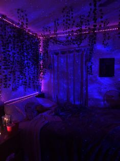 a bedroom with purple lights on the walls