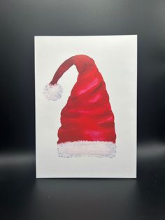 a card with a santa hat on it