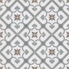 an artistic tile design in grey and white with brown stars on the center, as well as two smaller tiles