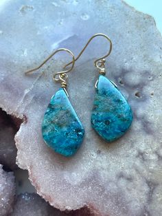 A gem lovers dream! Gorgeous rare one of a kind shattuckite earrings! Hang length is 38mm  23x15mm stone  Ear wire is 14kt gold filled Unique Long Drop Ear Wire Jewelry, Artisan Jewelry With Matching Drop Earrings, Artisan Teardrop Single Earring, Unique Gemstone Drop Earrings, Artisan Single Teardrop Earring, Artisan Teardrop Earrings With Ear Wire, Artisan Teardrop Earrings For Everyday, Bohemian Gemstone Earrings For Everyday, Unique Teardrop Crystal Earrings For Gift