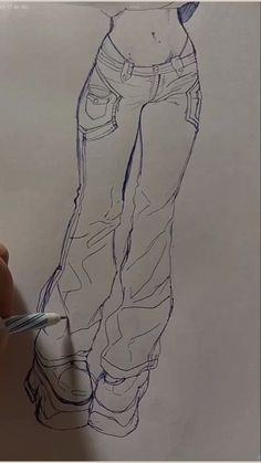 someone is drawing a man's jeans on paper