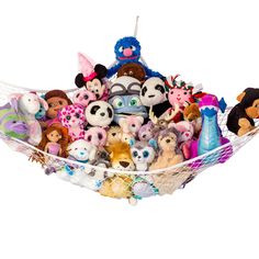 a hammock filled with lots of stuffed animals on top of each other in front of a white background