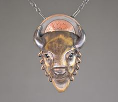 Celebrate your connection to nature and your spirit animal with this Bull Bison bronze necklace featuring a copper disc. The Bison is considered a symbol of abundance and manifesting goals. People with this totem are unafraid, often unpredictable, and willing to meet a challenge head on. This Bull Bison bronze necklace exhibits exquisite detail making this piece of totem jewelry a treasured gift. A true favorite of those who love animal totem jewelry. All items are hand-made, and as such there could be slight variations from the images shown. Spiritual Bronze Medallion Necklace, Bronze Medallion Necklace With Spiritual Style, Symbolic Bronze Necklace With Large Pendant, Spiritual Bronze Hammered Necklace, Spiritual Hammered Bronze Necklace, Artisan Copper Necklaces With Engraved Details, Engraved Copper Amulet Necklace, Artisan Engraved Copper Necklaces, Copper Medallion Amulet Jewelry