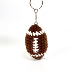 a crocheted keychain with a football on it