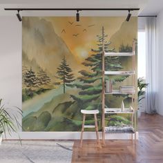 a wall mural with pine trees and birds in the sky, on a wooden floor