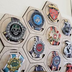 a wooden hexagonal display with many medals on it