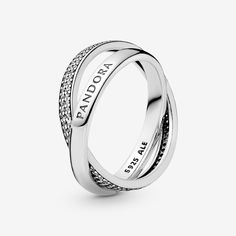 Shaped as two bands linked together as a symbol of kinship and connection, our sterling silver promise ring is set with cubic zirconia and stamped with our logo, both enduring symbols of our design and craftsmanship. An ideal gift for a special someone or a meaningful addition to your jewelry story, it looks equally cool worn stacked or solo. - Pandora FINAL SALE - Intertwined Pandora Logo and Pavé Ring - Sterling silver / Cubic Zirconia / Clear - Sz. 4.5 Pandora Logo, Pop Jewelry, Sterling Silver Promise Rings, Diy Jewelry Unique, International Jewelry, Large Jewelry, Pave Ring, Pandora Bracelets, Ring Pendant Necklace