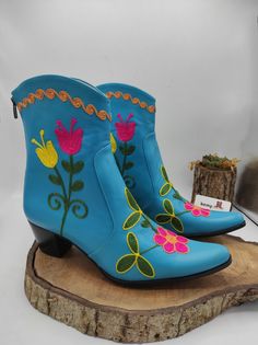 Handmade genuine leather custom boots. Very comfy and chic. Every size available. #ankleboots #anklebooties #cowboyboots #custom #forher #festivalboots #genuineleather #suzaniboots #bemyboots #shoesaddict #floral #turquoise #todayusa #newyork #bootsfashion Traditional Snip Toe Boots For Spring, Traditional Embroidered Boots For Spring, Handmade Traditional Snip Toe Boots, Handmade Ankle Boots For Festival, Handmade Western Boots, Traditional Boots With Floral Embroidery And Round Toe, Traditional Embroidered Boots For Festival, Traditional Embroidered Festival Boots, Traditional Handmade Closed Toe Boots