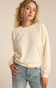 Get ready to snuggle up in the Saldana Reverse Fleece Top. With its super soft and comfortable reverse texture, this midweight pullover will be your go-to choice. The heavy soft wash adds an extra level of coziness, making it perfect for everyday wear. Plus, the regular fit and crew neck make it an easy, effortless option. Fabric: Reverse Cozy: 52% Polyester/48% Viscose Cozy Fit Sweats, Cozy Fleece Sweater With Soft Texture, Cozy Soft-washed Everyday Sweater, Comfy Soft Knit Sweatshirt For Loungewear, Cozy Fit Sweats With Soft Texture, Comfy Fleece Sweater With Soft Texture, Cozy Soft-washed Solid Color Sweater, Cozy Fleece Sweats, Cozy Crew Neck Sweats With Soft Texture