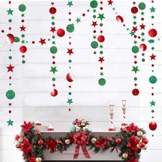 a fireplace decorated for christmas with red and green decorations