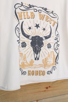 Wild West Rodeo Oversized Crop Tee The oversized Wild West Rodeo crop tee in an awesome tone of natural brings that desired western flair to your outfit. This unique piece features short sleeves, crew neck, cropped length, and a wild west steer head graphic design making it perfect for work or play. This wear everywhere graphic tee is a classic! Product Details Short Sleeves Crew Neck Cropped Length Wild West Steer Head Graphic Design Sizing - Small, Medium, Large Fabric - 100% Cotton Fit - True Head Graphic Design, Hoco 2023, Western Tshirt, Rodeo Poster, Wild West Theme, Steer Head, Grafic Tees, Boot Barn, Border Design