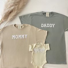 This matching family shirts is perfect for baby shower gifts, baby hospital coming outfit, pregnancy announcement, and family pictures or family photoshoot outfits! This is also perfect for gifting to your friends and loved ones for any occasions Note that the letters used are patches and are heat pressed. Our shirts run in a UNISEX fit. The shirts naturally have a slightly oversized fit giving extra room for moving around and comfort! For this reason, we highly recommend getting your true norma Customizable Cute Tops For Gender Reveal, Cute Cotton Shirt For Family Occasions, Personalized Cotton T-shirt For Gender Reveal, Personalized Family Matching T-shirt For Summer, Cute Family Shirt With Name Print, Customizable Cotton T-shirt For Gender Reveal, Cute Family Shirt With Letter Print, Customizable Short Sleeve Tops For Gender Reveal, Family Matching Tops For Gender Reveal In Summer