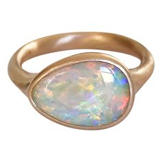 Dalben design 18k rose gold satin finishing ring with a 3,07 carat bezel-set pear shape magnificent Lightning Ridge Australian crystal opal . The Lightning Ridge Australian crystal Opal have pink, green. orange, blue spots. Ring size US 7 1/2 - EU 55 re-sizable to most finger sizes. Bezel setting dimension: width 14,2 mm, height 11 mm. The ring has been designed and handcrafted in our atelier in Italy Como with a rigorous quality workmanship . For a faster shipping service please choose "Buyer a Opal Rose Gold Ring, Italy Como, Rose Gold Satin, Rose Gold Opal Ring, Boulder Opal Ring, Vintage Cocktail Ring, The Lightning, Crystal Opal, Unusual Jewelry