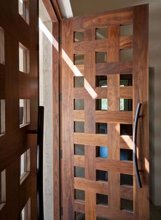 a wooden door with glass inserts on it