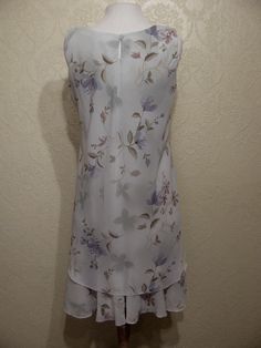 This is a very pretty 2 piece sleeveless long layered dress with matching long sheer chiffon jacket by r&m richards. still in brand new condition. it is a size 8. please go by the measurements below for proper fit. very elegant pretty women look. perfect for a garden party or summer wedding. the dress has a modest scoop neckline with a small keyhole button back. the dress is made of a pastel light sage green floral print crepe chiffon. the flowers are very light pastels of pinks and periwink Summer A-line Dress For Mother Of The Bride, Spring A-line Dress For Mother Of The Bride, Spring Knee-length Dress For Mother Of The Bride, Knee-length Spring Dress For Mother Of The Bride, Spring Formal Dress With Overlay, Summer Knee-length Dress For Mother Of The Bride, Knee-length Summer Dress For Mother Of The Bride, Mother Of The Bride Summer Knee-length Dress, Sleeveless Summer Dress For Mother Of The Bride