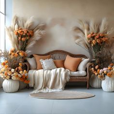 a living room filled with lots of furniture and flowers in vases on the floor