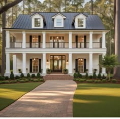 a large white house with black shutters on the front and second story, surrounded by trees