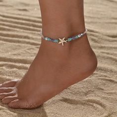 Step into the enchanting realm of summer with our Ocean Style Blue Beads Mixed Starfish Ladies Anklet, a mesmerizing piece of foot jewelry that captures the essence of the sea. Crafted with meticulous attention to detail, this anklet exudes coastal elegance with its delicate blue beads interspersed with whimsical starfish motifs. Each bead whispers of ocean waves, while the starfish adds a touch of playful charm, reminiscent of lazy days spent by the shore. Whether you're wandering along sandy b Starfish-shaped Beaded Beach Jewelry, Summer Strand Anklet With Starfish Charm, Summer Strand Beaded Bracelets With Starfish Charm, Summer Beach Anklets With Starfish Charm, Blue Beaded Starfish Anklet, Summer Beaded Strand Bracelets With Starfish Charm, Summer Beaded Bracelet With Starfish Charm, Summer Beaded Strand Bracelet With Starfish Charm, Starfish Anklets For Summer Vacation