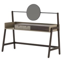 a desk with a mirror on top of it next to a wooden frame and drawers