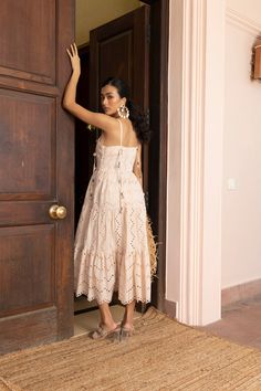 Embroidery galore- yes, please! The Frankie is a tiered dress embellished with cowrie shells and scalloped to perfection. Dress her down or up, she will be on repeat for you this entire season, we promise. The model is wearing size S. 🌸 〰️〰️〰️ 🌸 〰️〰️〰️ 🌸 Care and Composition100% Cotton.Dry clean/Hand wash in cold water. Mild liquid detergent only. Do not soak or wring. Designed & Made in India. Beige Tiered Skirt Dress With Ruffle Hem, Summer Midi Dress With Scalloped Edges, Beige Tiered Skirt Beach Dress, Beige Tiered Skirt Dress For Beach, Beige Tiered Skirt Dress For The Beach, Beige Tiered Skirt Dress For Vacation, Beige Ruffle Hem Sundress, Beige Sundress With Ruffle Hem, Bohemian Tiered Midi Dress For Dress Down