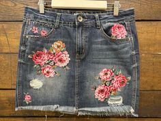 Elevate your boho chic style in this OOAK upcycled denim skirt. Hand stitched appliqués are sprinkled over expertly distressed denim making a stand out fashion statement while adding whimsy and feminine flair Rewash Brand denim skirt, size 7. Waist width 15.5 in, side length 15 inches All of my designs start with donated, thrifted, & gifted clothing, vintage textiles, fabric, and notions. I am passionate about reusing items and appreciating the value and quality of used, preloved goods. I try to Bohemian Dark Wash Bottoms For Spring, Bohemian Denim Bottoms With Floral Print, Summer Bohemian Denim Skirt With Frayed Hem, Bohemian Summer Denim Skirt With Frayed Hem, Spring Bohemian Denim Skirt With Frayed Hem, Bohemian Spring Denim Skirt With Frayed Hem, Bohemian Denim Skirt With Frayed Hem For Spring, Bohemian Cotton Denim Skirt With Frayed Hem, Bohemian Denim Skirt For Festival