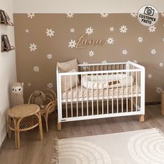 a baby's room decorated in brown and white