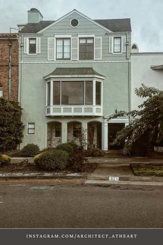 an old house with many windows and balconies