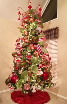 a christmas tree decorated with red and green ornaments