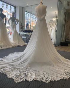 the back of a wedding dress on display at a bridal fashion store in london