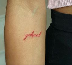 two people with tattoos on their arms and one has a tattoo that says, godped