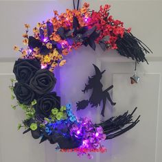 a wreath made out of fake flowers and lights