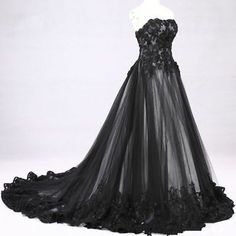 a black wedding dress with flowers on it