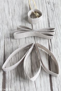 some scissors are laying on a white table