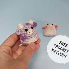 two small crocheted animals sitting next to each other