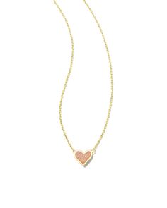 The bestseller you know and love, now in a flirty new design! The Framed Ari Heart Gold Short Pendant Necklace in Light Pink Drusy features a smaller heart shape in a sleek metal frame embellished with our signature hoofprint detailing. Dainty and oh-so-sweet, this pendant will add a touch of romance to your necklace stack. Metal 14k Gold Over Brass Material Light Pink Drusy Closure Spring Ring Clasp Size 19" Chain, 0.49"L X 0.36"W PendantDue to the one-of-a-kind nature of the medium, exact colo Hoof Print, Mood Stone, Short Pendant Necklace, Rose Gold Pendant Necklace, Preppy Jewelry, Heart Shaped Frame, Gold Shorts, Kendra Scott Necklace, Rose Gold Pendant